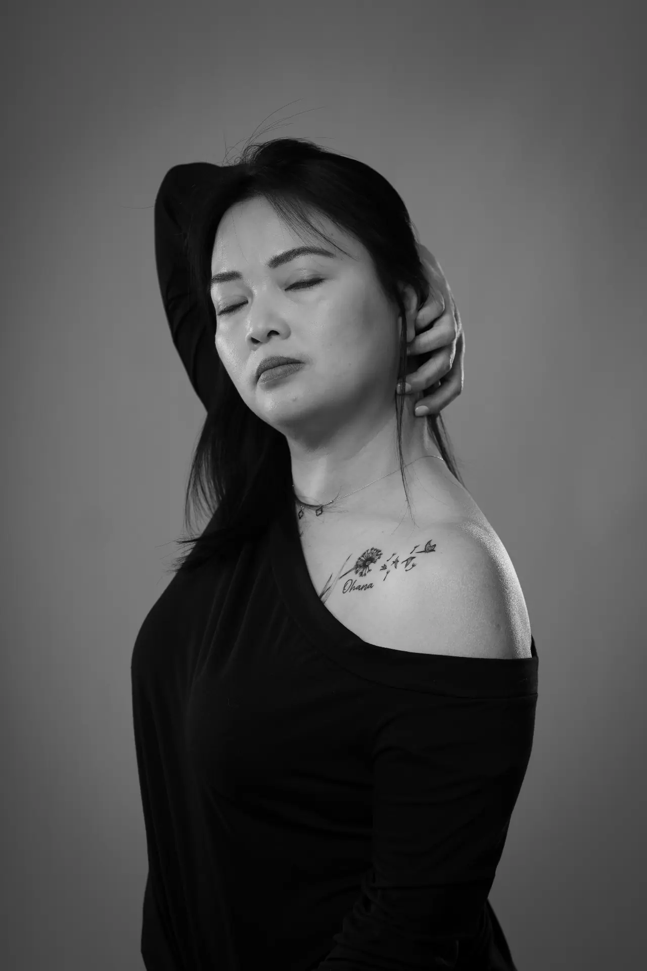 Black and white studio portrait — ohana tattoo